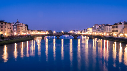 Ponte alla Carraia glowing in early morning light , Florence Italy