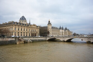 Naklejka premium Historic Paris Architecture and Stone Bridge Over the Seine River 
