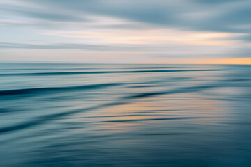 Obraz premium Ethereal waves flow in a blurred dance of blues and oranges in a serene seascape