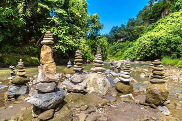 Balanced stones by the river