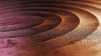 The image features beautiful circular patterns with warm gradient hues, creating a luminous and shimmering effect. The texture adds depth to the visual.