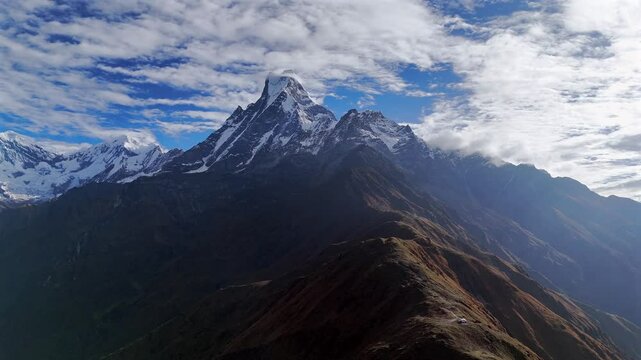 Machapuchare (Fishtail) mountain in the Annapurna Himalayas of Nepal. Aerial drone video from the west of the peak which is often called the Matterhorn of  Nepal.