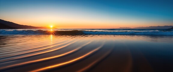 Sunset beach with waves rolling onto the shore