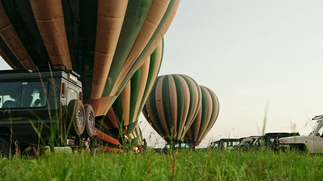 Hot air balloons being inflated ready for take off in the Serengeti, Tanzania