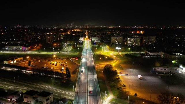 Mesmerizing hyperlapse of night traffic flowing through a city, showcasing the vibrant urban landscape and the continuous movement of vehicles.