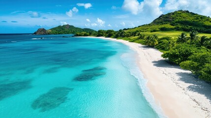 Obraz premium Aerial View of a Tropical Beach with Turquoise Water and Green Hills in Background