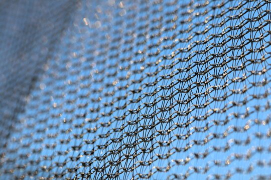Protective mesh of the walls from a children's trampoline made of fabric durable synthetic mesh