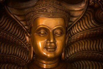 Close up bronze Khmer style Buddha face from Thailand (Phra Vachiramongkol Naga Prok)