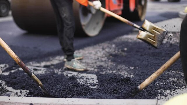 Roadworks, process of asphalting, blacktopping and paving new road layer, laying new asphalt road pavement, paver machine and steam roller compactor, city street construction site, vehicle working
