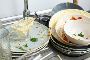 Dirty dishes in sink, closeup