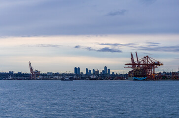 Seashore Industrial Port with City Skyline at Dusk in Vancouver, Canada