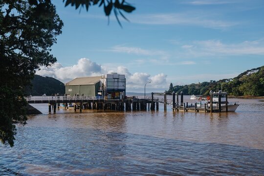 Moana tour boat docks at the harbor. Sunny day at the marina. A scenic view of the harbor. , Mangonui, Northland, NZ