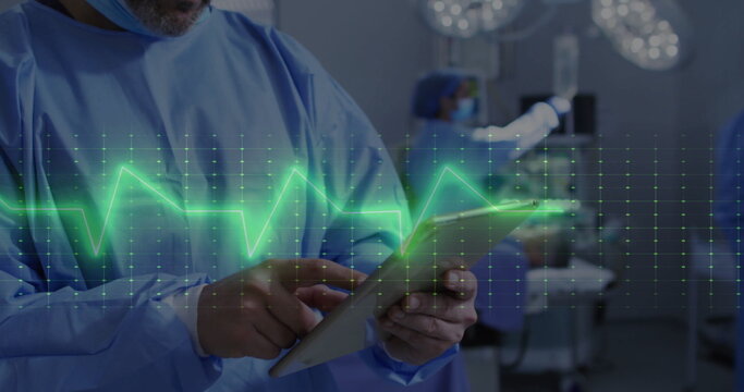 Image of cardiograph over diverse surgeons during surgery