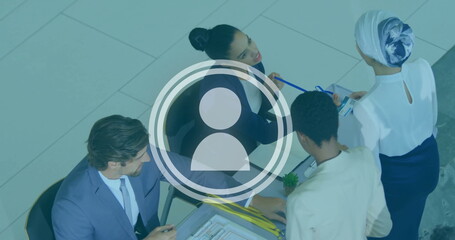 Image of people icon over diverse business people in office