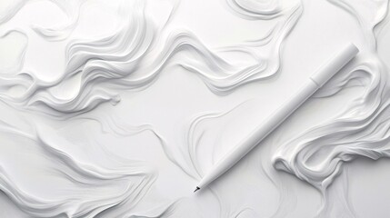 Obraz premium White pen lying on a white wavy abstract background