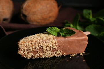 Plate with tasty cheesecake pop, closeup