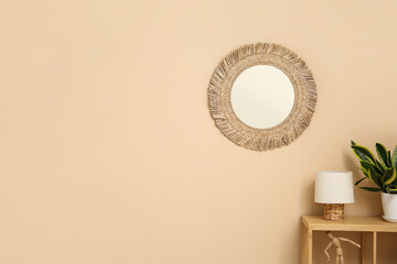 Modern living room with shelving unit, houseplant, lamp and mirror