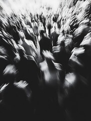 Abstract black and white image of a crowd of people in motion