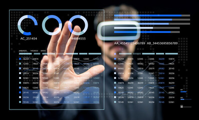 Business Professional Engaged in Virtual Reality Experience with Data Visualization on Display in Futuristic Office Environment