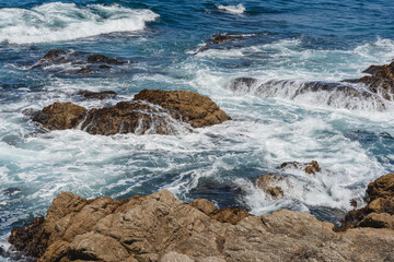 waves crashing on rocks