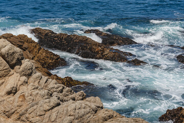 waves crashing on rocks
