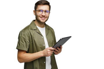 Young man with glasses holds a tablet and smiles confidently in a professional setting