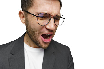 Man expresses intense emotion while wearing glasses and a blazer in a neutral setting