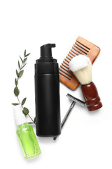 Set of men's shaving accessories with eucalyptus branch on white background