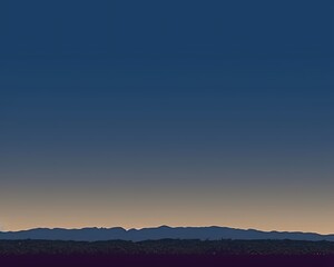 Obraz premium Twilight landscape with silhouetted mountains and a gradient sky.