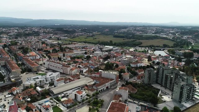 Aerial drone shot of the &Aacute;gueda River and the &Aacute;gueda city center in Portugal.
