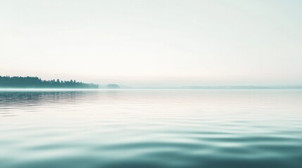 Obraz premium Serene misty lake at dawn, tranquil water reflecting soft light, peaceful atmosphere.