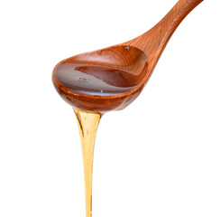 Drop syrup isolated and wood spoon on white background