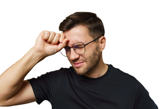 Man wearing glasses looks stressed while touching his forehead in a neutral background