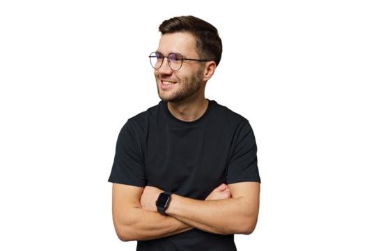 Smiling man with glasses stands confidently with arms crossed against a white background