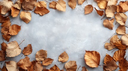 Obraz premium Dried Autumn Leaves Frame On Gray Background