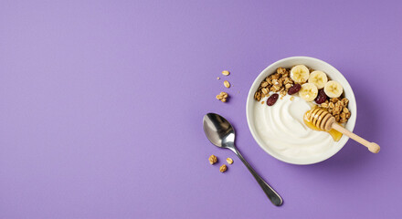 A bowl of Greek yogurt with honey and granola on a lavender background with negative space for text or graphics, ideal for minimalistic and visually appealing designs
