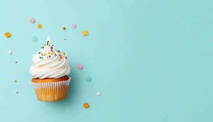 Delicious cupcake with frosting and colorful sprinkles on a pastel blue background