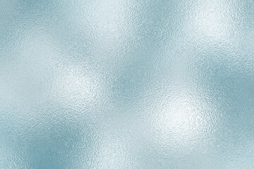 Shiny silver foil texture. Soft blue foil glass texture background. Abstract gradient bright light reflection and shiny rough texture surface. Glass effect background	