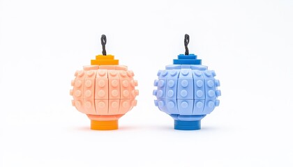 Obraz premium Colorful silicone toys in orange and blue, designed for play, showcased against a clean white background