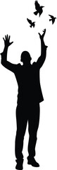 Silhouette of a man with birds flying