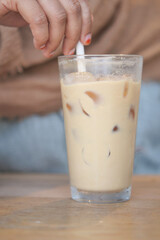 Enjoy a Refreshing Iced Coffee with Creamy Swirls and Ice Cubes for a perfect treat
