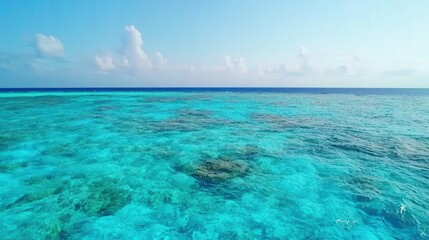 Fototapeta premium Seascape and waves dynamic, A serene view of turquoise waters under a clear sky, showcasing the beauty of the ocean and its tranquil environment.