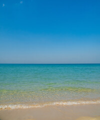 Photography landscape beautiful summer season vertical look view horizon tropical shore open sea cloud clean blue sky background calm nature ocean wave water nobody travel at Thailand sun day time.
