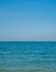 Obraz premium Photography landscape beautiful summer season vertical look view horizon tropical shore open sea cloud clean blue sky background calm nature ocean wave water nobody travel at Thailand sun day time.