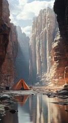 Tent in a scenic canyon landscape under clouds.
