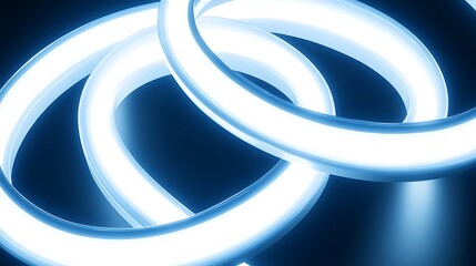 Intertwined luminous rings glowing brightly in the dark
