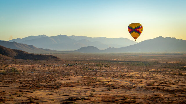 Colorful pattern hot air balloon in the skies over the Phoenix Arizona Sonoran Desert. Photo taken on a clear day