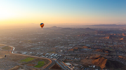 Colorful pattern hot air balloon in the skies over the Phoenix Arizona Sonoran Desert. Photo taken on a clear day