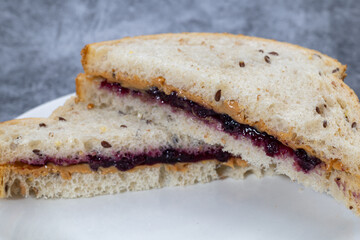 Peanut butter and jelly sandwich close up.