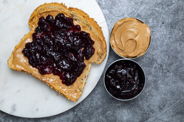 Peanut butter and jam on toast close up.